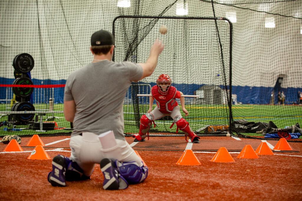 Baseball catcher blocking a baseball